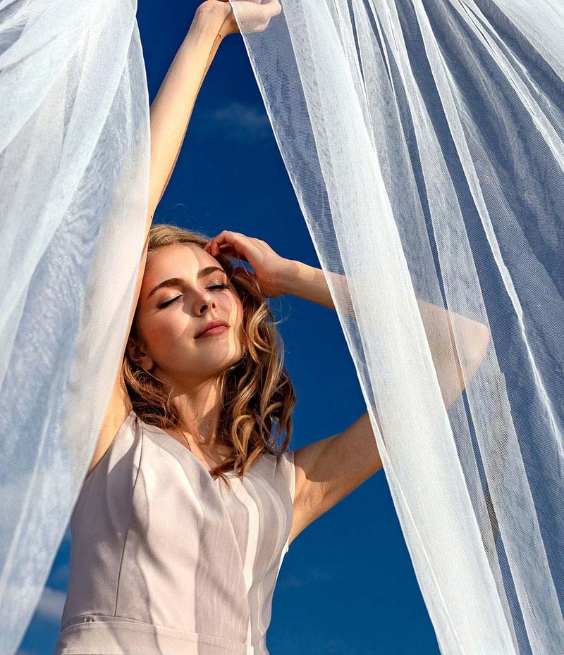 Woman behind white dressing