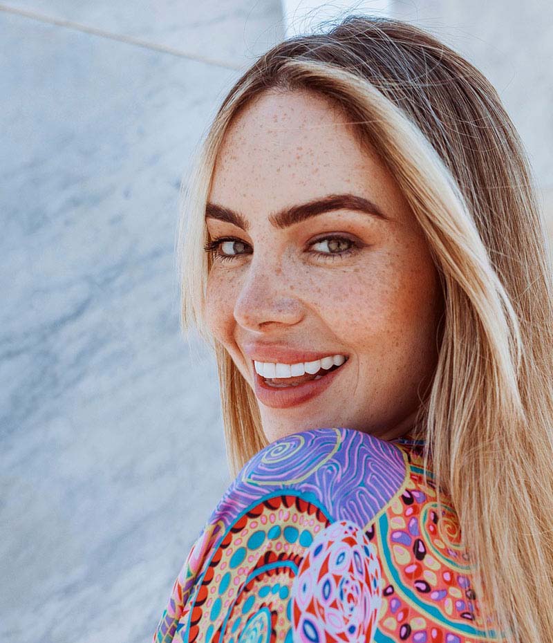 Woman looking back over her shoulder and smiling