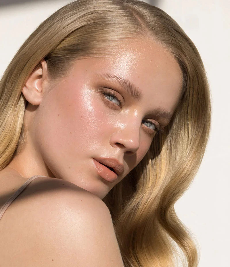 Blonde woman looking over her shoulder