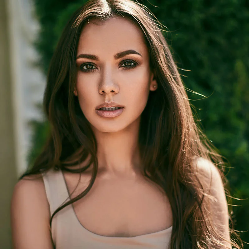 Brunette woman in tan top