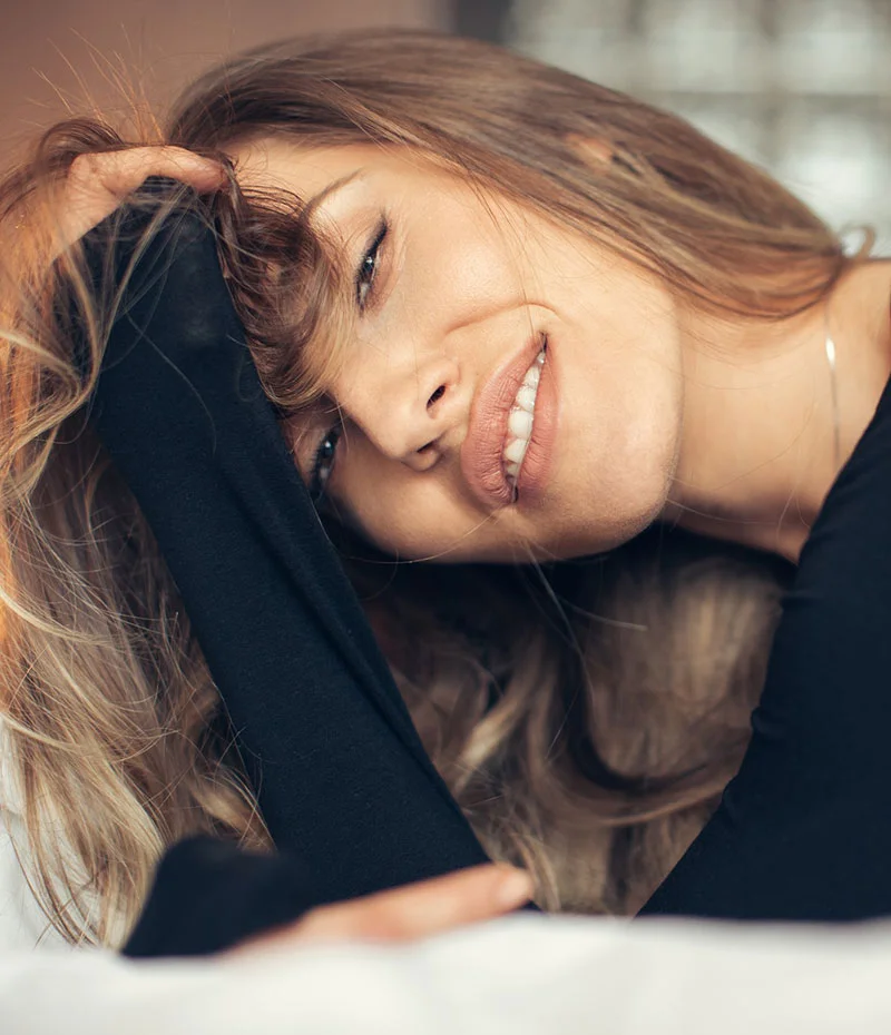 Woman leaning into her hands